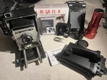 Speed Graphic Lot With Lenses, Lomograflok, Developing Tank And Film Holders Used. Price: $1100.00.