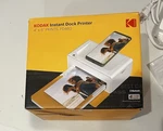 Kodak Instant Dock Photo Printer (PD460) - Sealed Open. Price: $70.00.